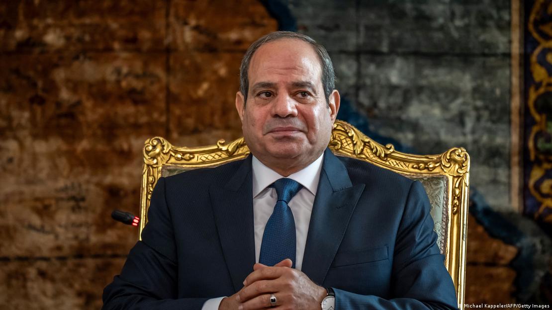 Egypt's President Abdul Fattah al-Sisi sits in a golden chair