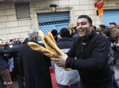 A Tunisian with fresh bread (photo: AP)