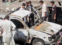 Car, destroyed by suicide bomber, Balad, Iraq (photo: AP)