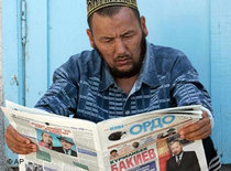 A Kyrgyz man reads a newspaper (photo: AP)