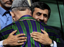 Iranian president Mahmoud Ahmadinejad embracing Afghan President Hamid Karzai (photo: AP)