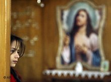 A Christian girl in a church in Iraq (photo: AP)