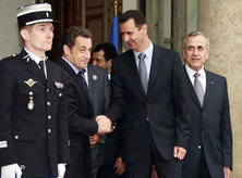 Bashar Assad and Nicolas Sarkozy shake hands (photo: AP)