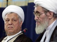 Former Iranian President Rafsanjani, left, looks to leader of hard-line Iranian Experts Assembly (IEA), Ayatollah Ali Meshkini, September 2002