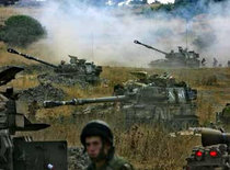 Israeli artillery pieces fire across the border into southern Lebanon (photo: AP)