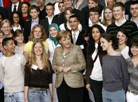 German Chancellor Merkel and immigrants' representatives at the Integration Summit (photo: AP)