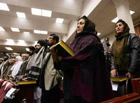 Afghan parliament members hold copies of the holy book Quran during their swearing-in ceremony in Kabul, Afghanistan (photo: AP)