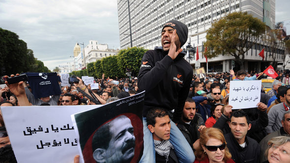 Anti-Ennahda demonstration in Tunis following the murder of opposition politician Chokri Belaid (photo: Fethi Belaid/AFP/Getty Images)