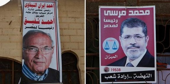 Wahlplakate Ahmed Shafiks (links) und Mohamed Mursis (rechts); Foto: dapd/DW-Montage