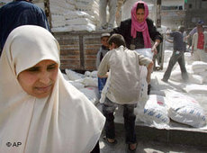 Women in Gaza City receiving food supplies from the UNRWA (photo: AP)