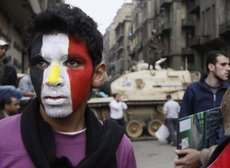 Junge demonstriert gegen das Mubarak-Regime in Kairo; Foto: AP