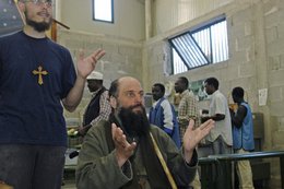 Biagio Conte, center, in his mission (photo: Ikhlas Abbis)