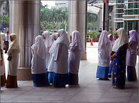 Women with headscarves, Malaysia (photo: Yale Global)