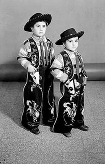 Two young boys dressed as cowboys (photo: Arab Image Foundation)