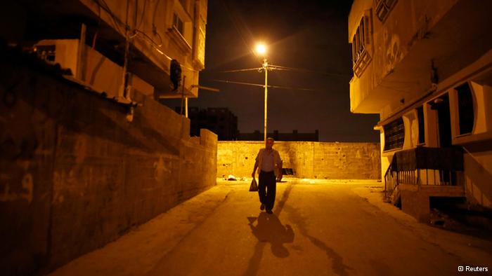 Taysir Abu Sharif Hader is one of 47,000 Palestinians with an official work permit who cross the border from the West Bank every day. Every morning before sunrise, he makes his way to the Qalqilya checkpoint to get to his job in Israel (photo: Reuters)