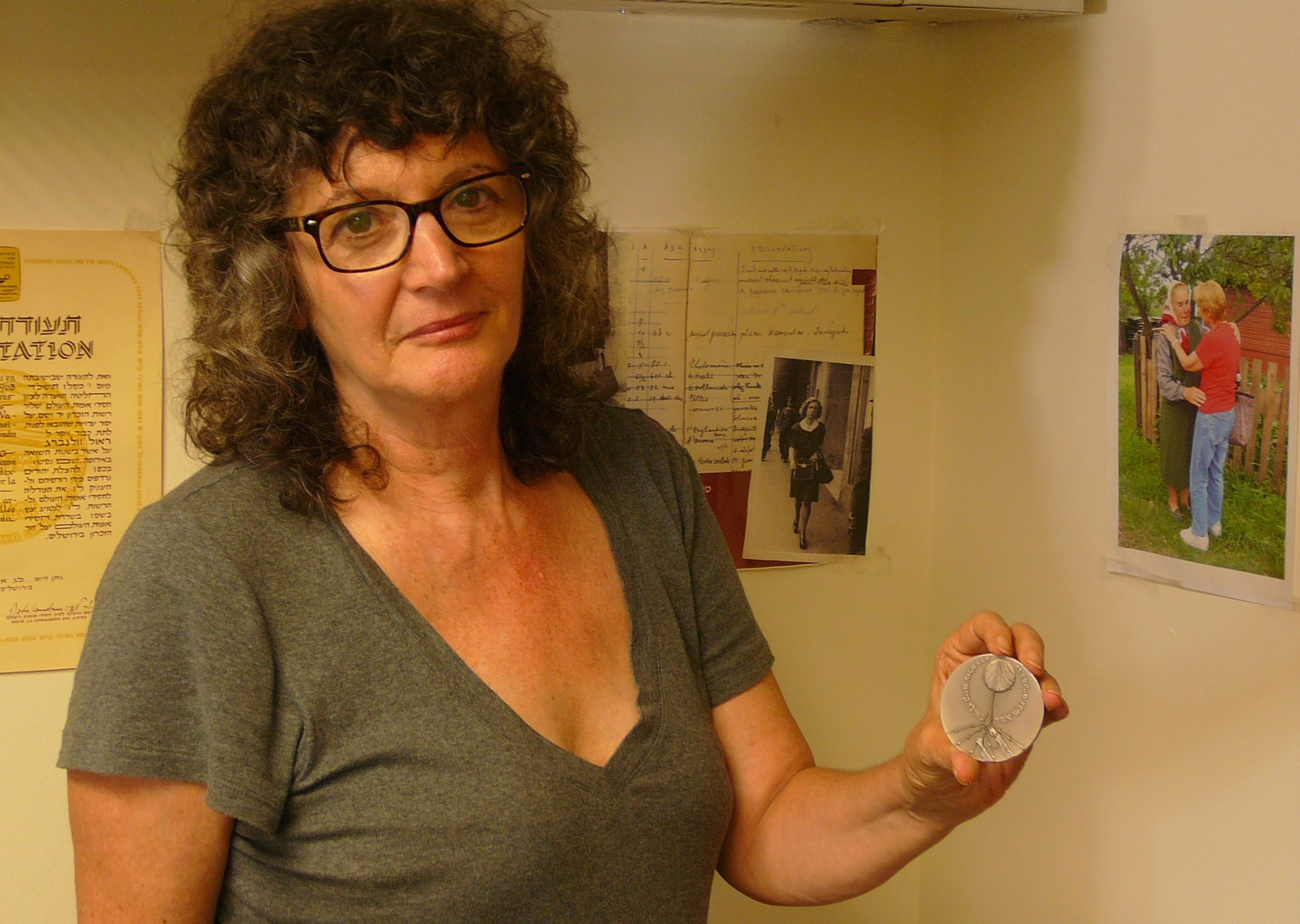 Irena Steinfeldt with the award medal for Mohamed Helmy in her Jerusalem office (photo: Igal Avidan)
