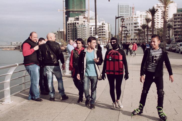 Artist Rima Najdi walks along Beirut's Corniche wearing a fake explosive belt on 12 January 2014 (photo: Maria Kassab)