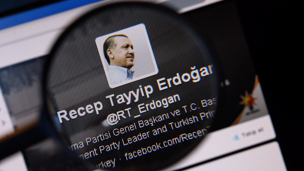 An image of Turkish Prime Minister Tayyip Erdogan on a twitter account page viewed through a magnifying glass (photo: Reuters)