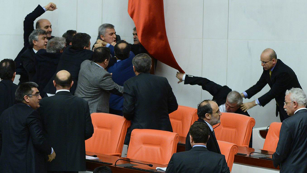 Members of parliament from the ruling AKP and the CHP involved in a scuffle during a debate on a justice bill, 15 February 2014 (photo: Reuters)