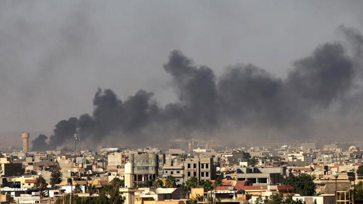 Dark smoke rising above the Tripoli skyline (photo: Reuters)