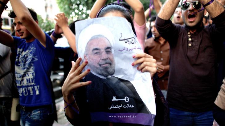 A supporter of President Hassan Rouhani in Tehran (photo. Behrouz Mehri/AFP/Getty Images)