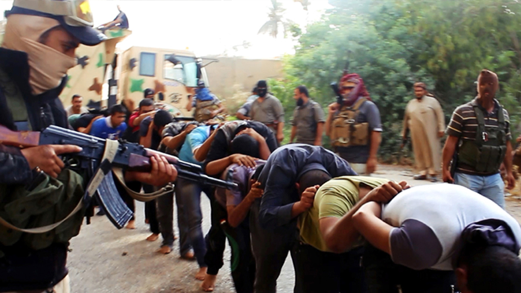 IS militants leading away captured Iraqi soldiers, Tikrit, Iraq, 14 June 2014 (photo: AP)
