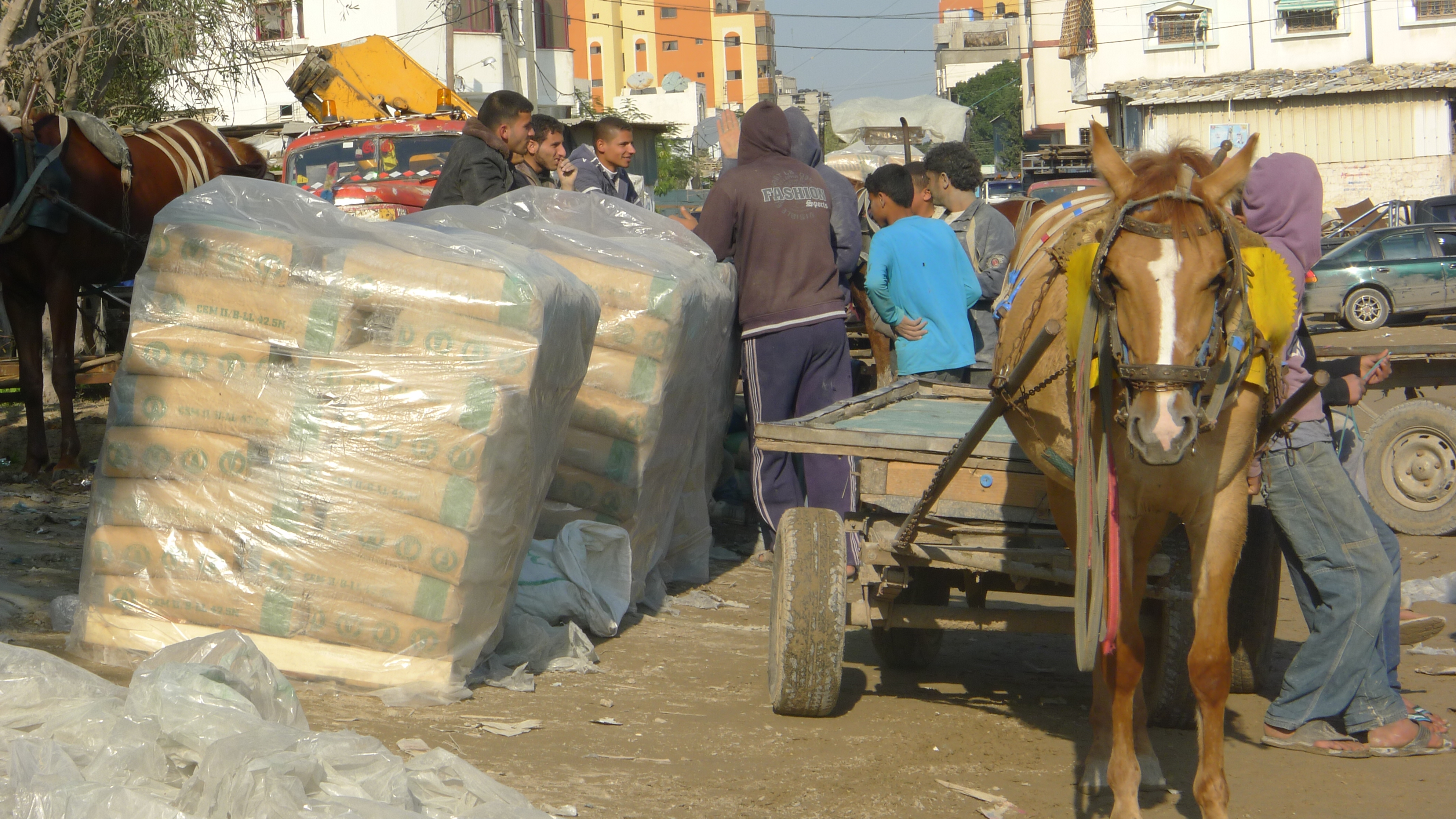 Cement traders outside the Shamali warehouse in Shejaia, Gaza (photo: Ylenia Gostoli)