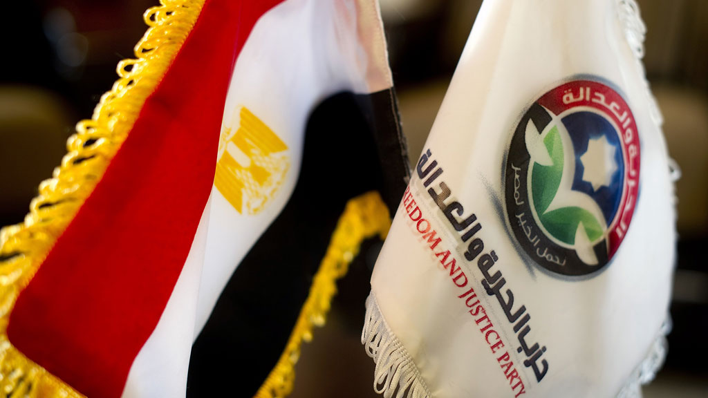 Egyptian flag next to a flag of the Freedom and Justice Party (photo: AFP/Getty Images)