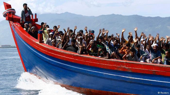 Flüchtlinge auf einem Boot. Foto: Reuters