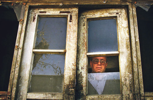 Zebulon Simentov, the last Jew of Kabul, looking out of the window (photo: Reuters)