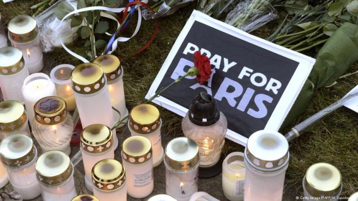 Mourning the victims of the Paris attacks on 13 November 2015 (photo: Getty Images/AFP)