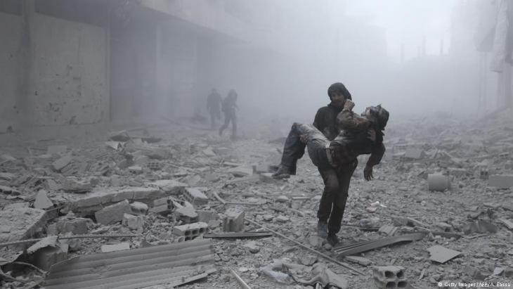 Rescuing injured civilians following a government airstrike on Eastern Ghouta (photo: Getty Images/AFP)