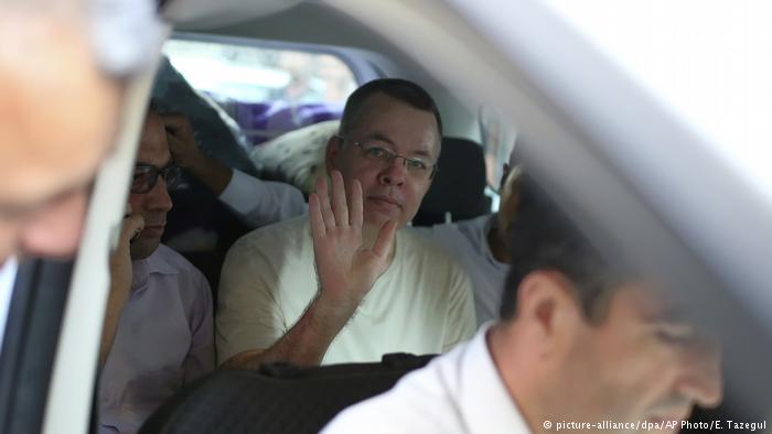 Brunson waves from his car as he arrives at his house in Izmir