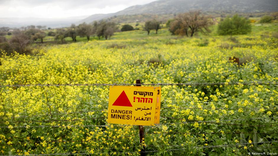 A sign warning of landmines is seen on a fence in the Golan Heights, the territory that Israel captured from Syria and occupied in the 1967 Middle East war (photo: Reuters/R. Zvulun)