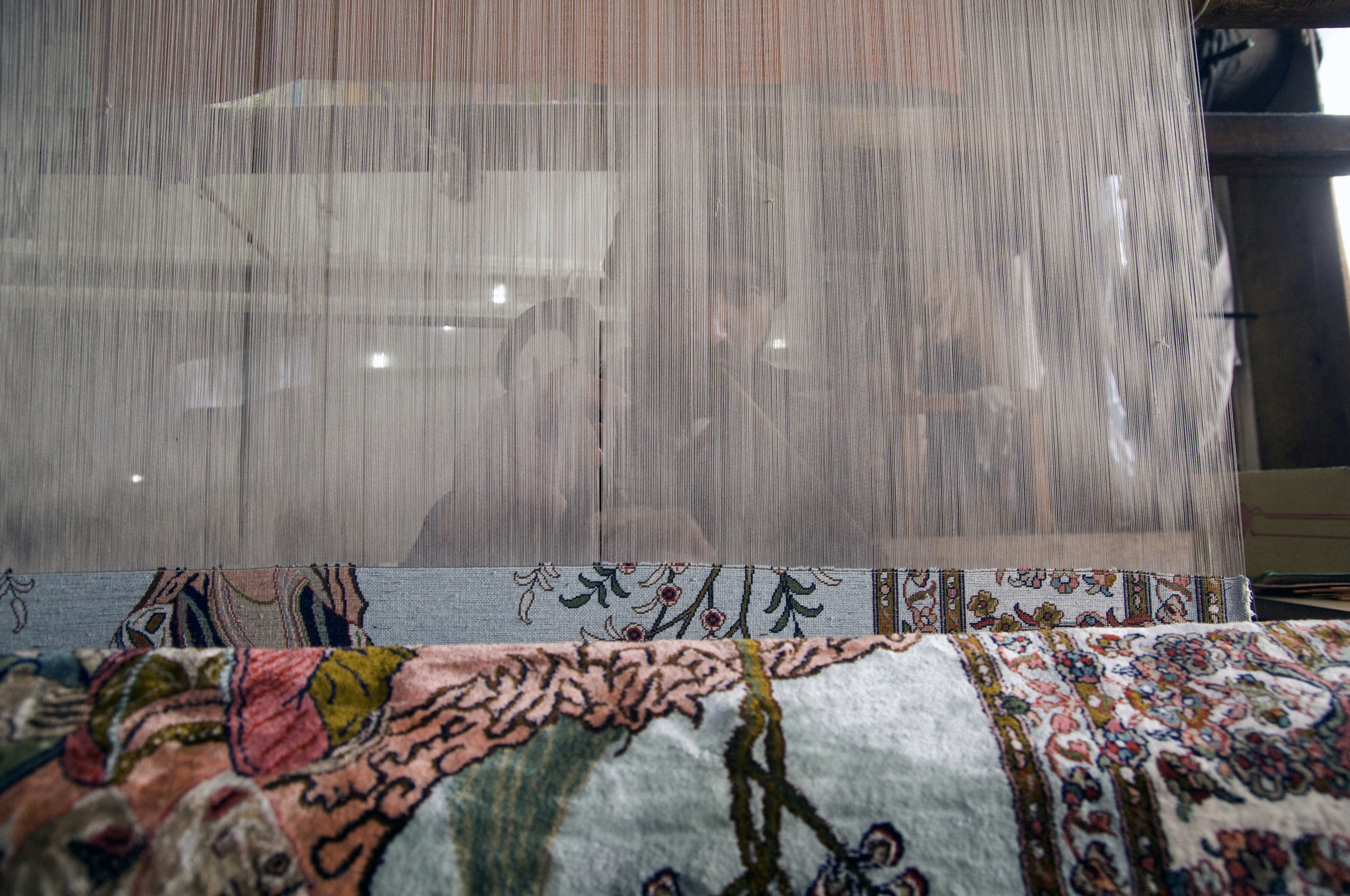 A weaver sits behind his loom (photo: Sugato Mukherjee)