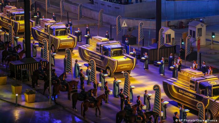 Golden parade of Pharaohs; procession of vehicles at night