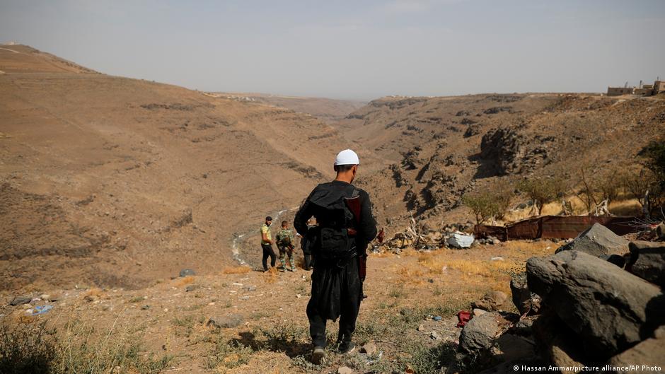 Armed young Druze patrol the countryside around the village of Rami in the southern province of Sweida, Syria, in 2018 (photo: AP Photo/Hassan Ammar)