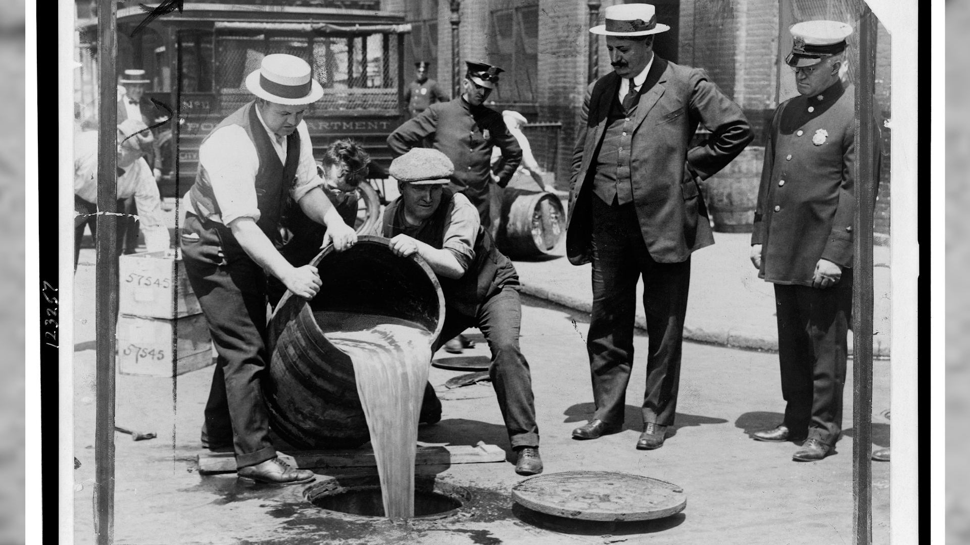 New York City Deputy Police Commissioner John Leach watching agents pour liquor into sewer following a raid during the height of prohibition 1920-1933 (image: Wikipedia)