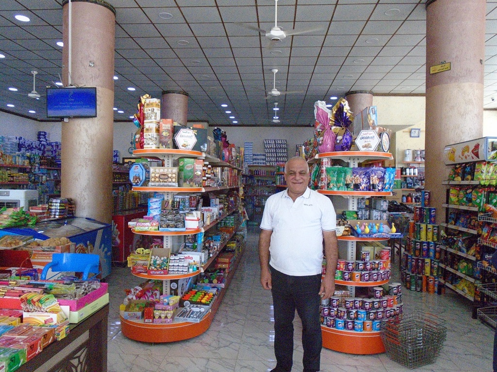 Noury in his new supermarket in Karakosh, Iraq