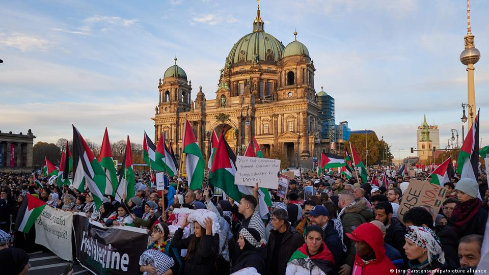 Thousands of people carrying Palestinian flags and placards demonstrate in Berlin