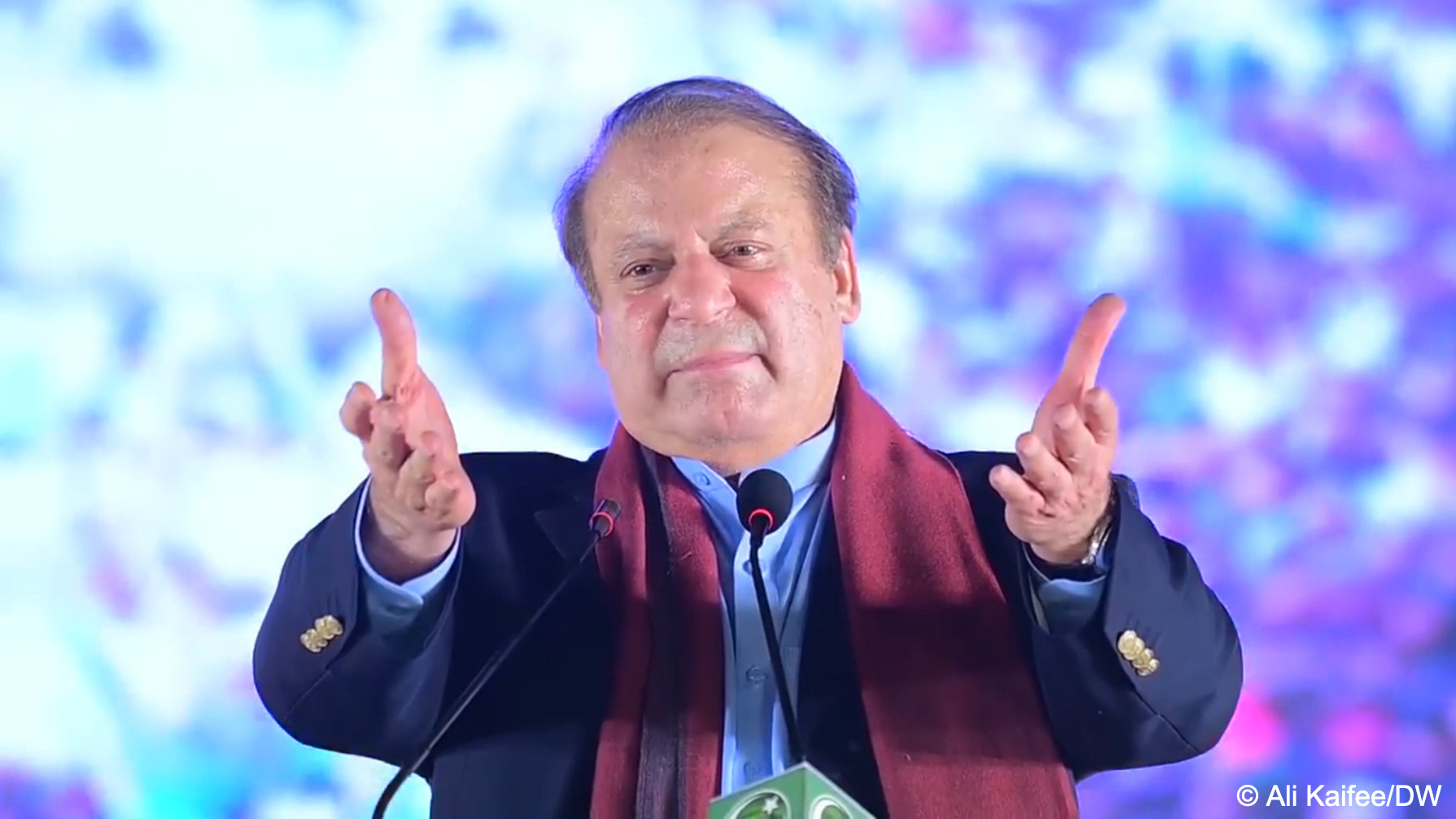 Former Pakistani PM Nawaz Sharif stretches out both hands as he addresses a crowd of supporters at a public rally in Lahore, Pakistan, 21 October 2023