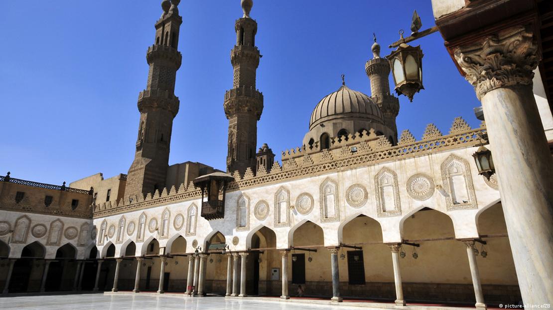The pillars, minaret and dome of Al-Azhar Mosque in Cairo are seen beneath a cloudless blue sky