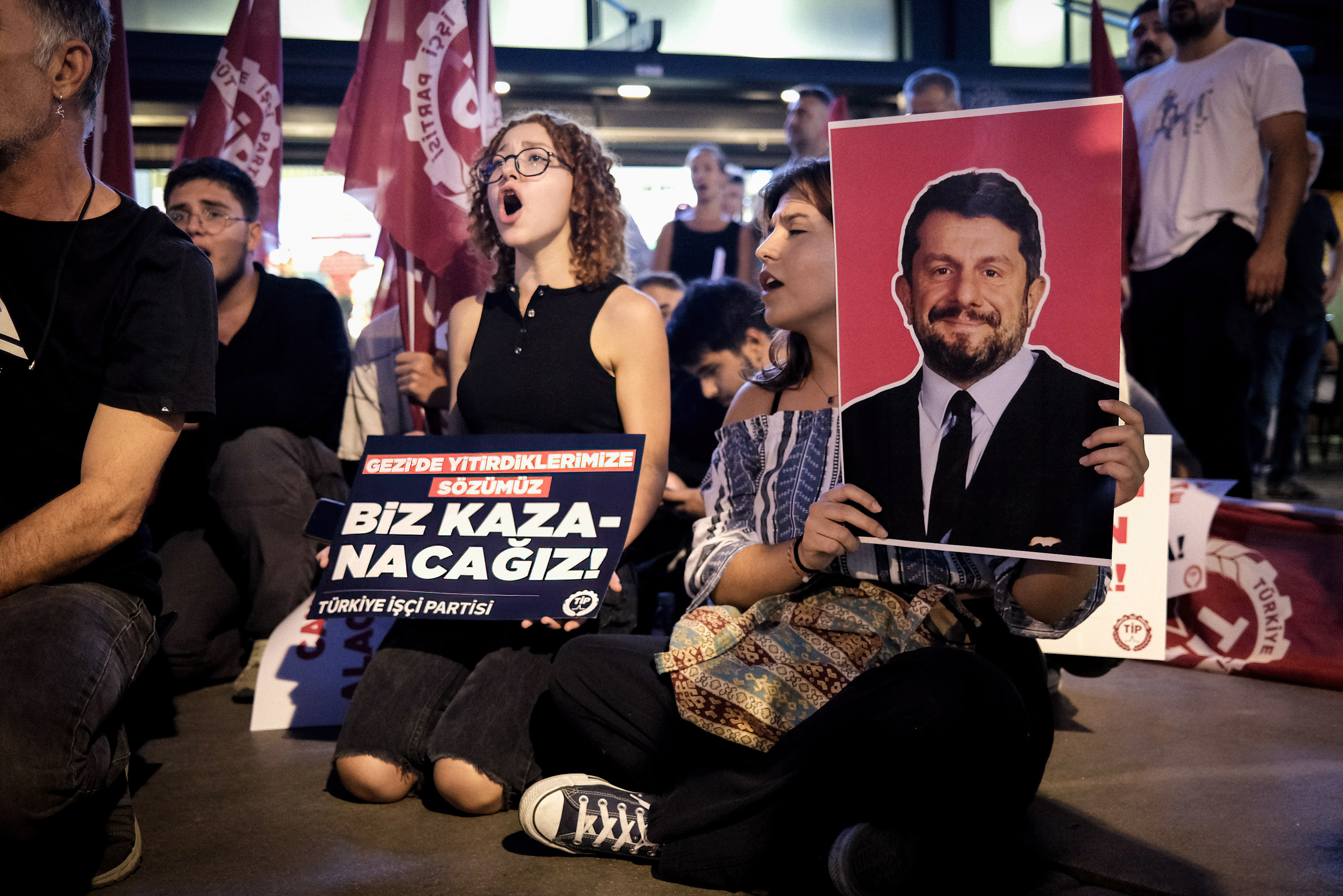Members of the Workers' Party of Turkey TIP hold up placards, flags and photos of Can Atalay during a pro-Atalay sit-in protest, Izmir, Turkey, 29 September 2023