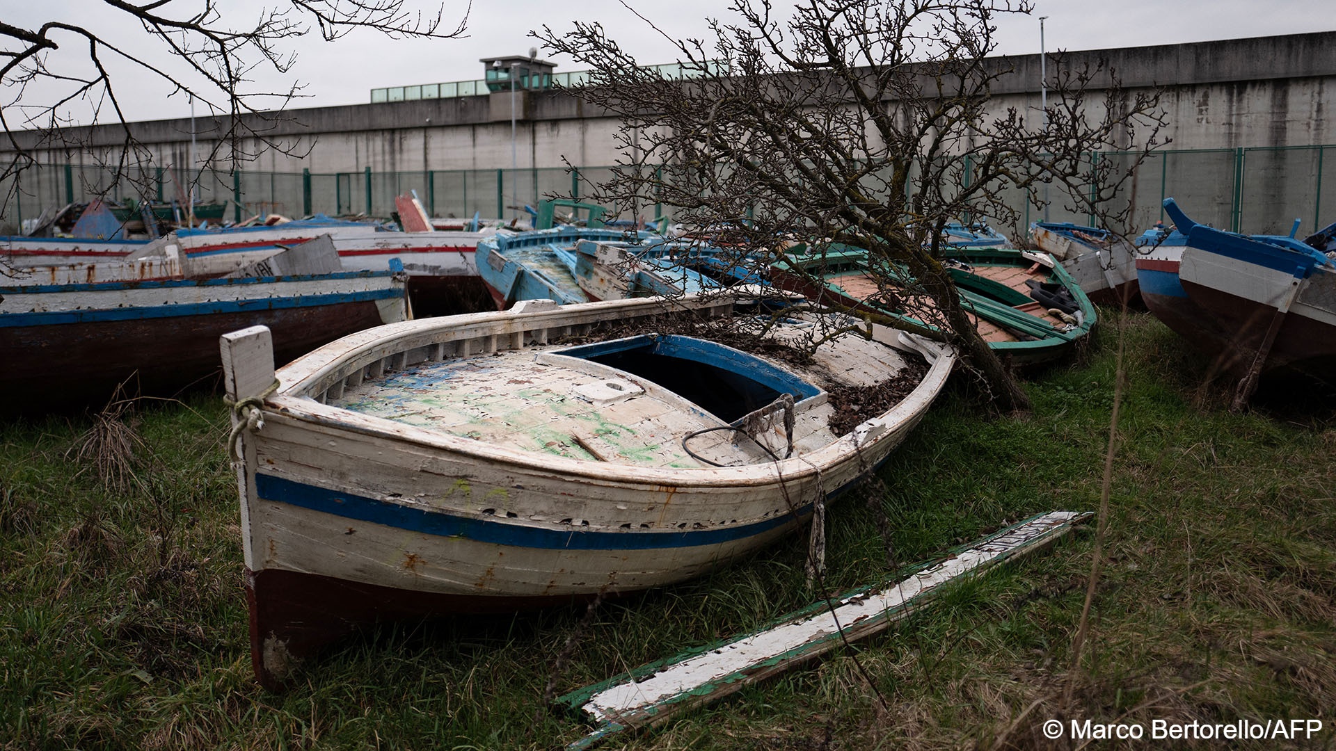 Rickety boats that are no longer seaworthy rest high and dry