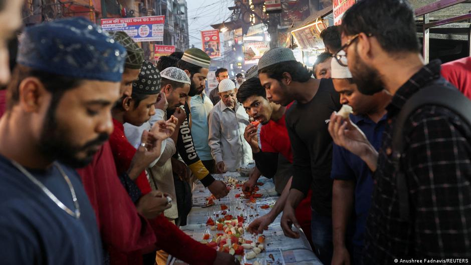 Long tables are set up on the streets of New Delhi, the mega-city in northern India, where Muslims eat together during Ramadan