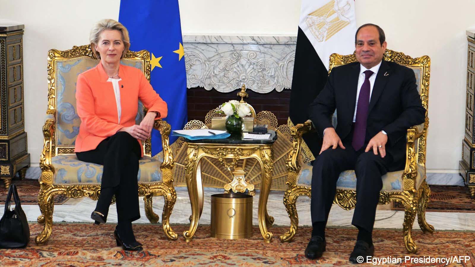 European Commission President Ursula von der Leyen (left) and Egyptian President Abdul Fattah al-Sisi (right) sit on armchairs on either side of a table