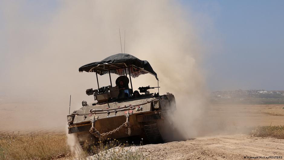 Israeli soldiers ride in a military vehicle near the Israel-Gaza border, amid the ongoing conflict between Israel and the Palestinian Islamist group Hamas