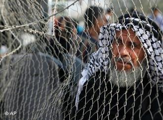 A Palestinian before crossing into Egypt through the Rafah border crossing  AP