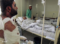 Injured Afghans in a hospital in Kabul after the NATO air strike against hijacked road tankers near Kunduz (photo: AP)