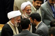 Ayatollah Mesbah Yazdi (left) shakes hands with Ahmadinejad (right) (photo: AP)